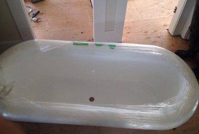 A clawfoot bathtub fully wrapped for moving