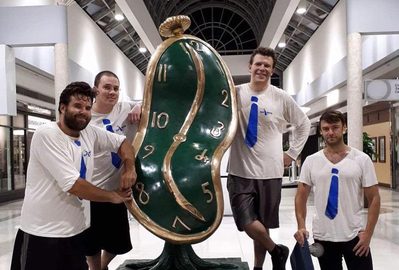 The Nash crew beside a large melting-clock Dalí sculpture