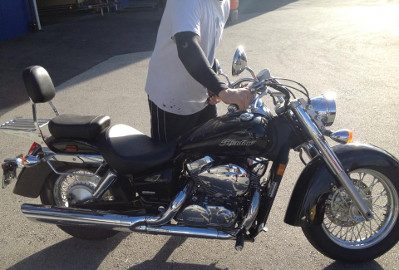 A cruiser motorcycle carefully loaded for transport