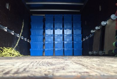 Blue Nash moving tubs stacked floor to ceiling in the truck